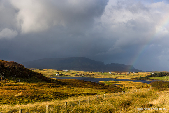 A faint rainbow in Scottish landscape